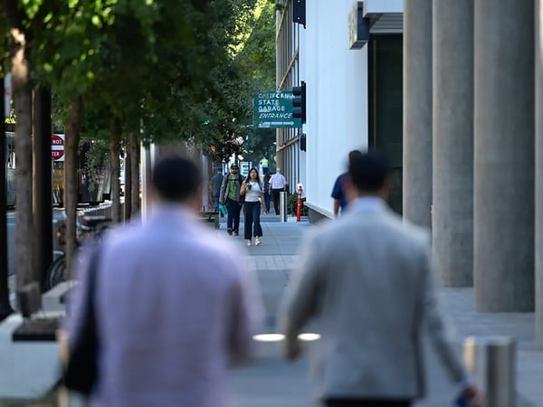 State workers and city residents walk through downtown Sacramento on the morning of July 15, 2026. Photo by Miguel Gutierrez Jr., CalMatters