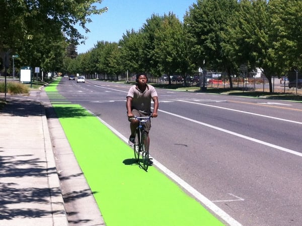Carl Furdge rides his bike to school and across campus to go to work.  He says he thinks the new lanes will help bicyclists, pedestrians, and motorists share the road.