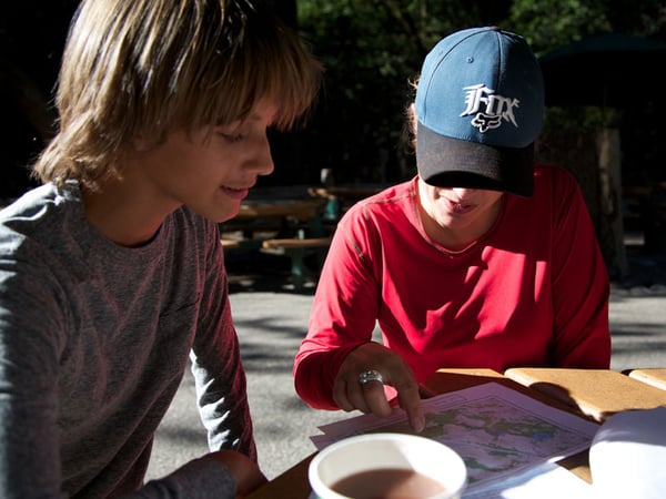 Danielle Grate checks a map with one of her students during her trek into the Inyo National Forest.