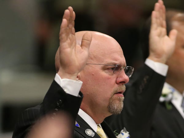In this Feb. 4, 2013, file photo, Nevada Assembly Republicans Ira Hansen, takes the oath of office during the opening day of the 77th Legislative Session in Carson City, Nev. 