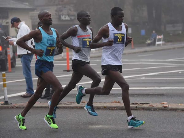 A trio of runners lead the pack at the 20-mile mark of the California International Marathon, Dec. 7, 2014 in Sacramento. Jacob Chemtai, center (No. 9), was the race winner.
