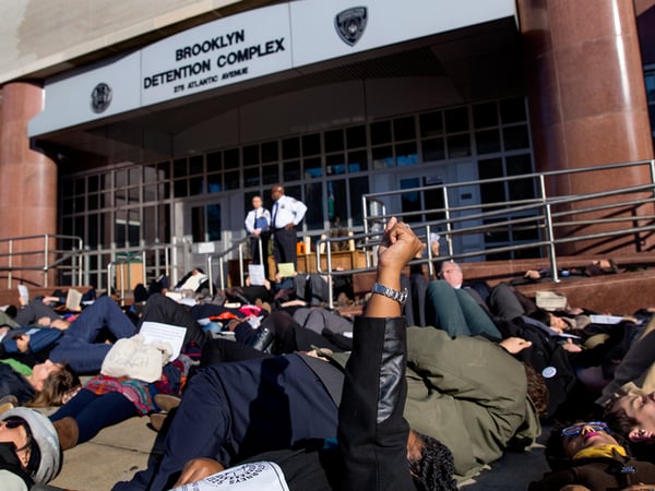 Public defenders, members of the legal community and others lay down during a "die-in" protest in the Brooklyn borough of New York Wednesday, Dec. 17, 2014. 