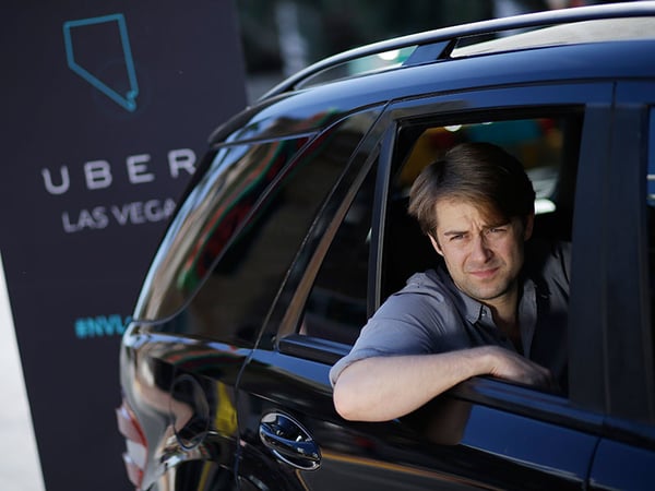 Uber West Coast Regional Manager William Barnes sits in the back of a car during a photo shoot Friday, Oct. 24, 2014, in Las Vegas.
