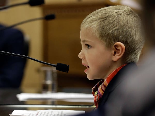 Rhett Krawitt, 6, who could not be vaccinated while he was being treated for leukemia, speaks to lawmakers about approval of a measure requiring California schoolchildren to be vaccinated during a hearing of the Senate Education Committee April 15. 