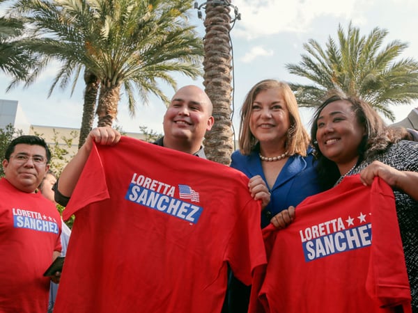 California Rep. Loretta Sanchez, second from right, poses for a photo with supporters, Daniel Cisneros, second from left, and Eboney Pearson, right, at the California Democrats State Convention in Anaheim, Calif., on Saturday, May 16, 2015.