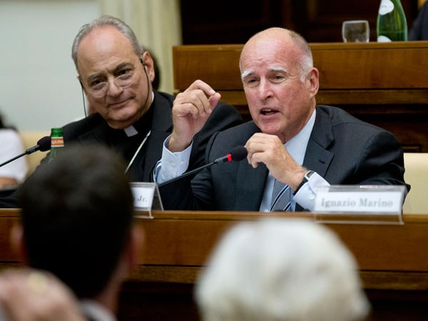 Gov. Jerry Brown, right, delivers his speech flanked by the head of the pontifical academy of Science, Bishop Marcelo Sanchez Sorondo, during a conference on Modern Slavery and Climate Change in the Casina Pio IV the Vatican, July 22, 2015.