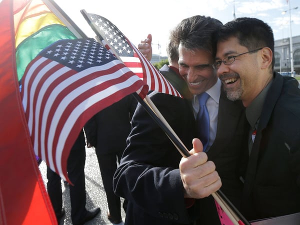State Sen. Mark Leno, left, hugs gay rights advocate Stuart Gaffney, with the group Marriage Equality USA, across the street from City Hall in San Francisco, Friday, June 26, 2015.