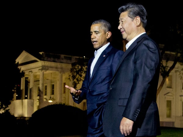 In this Thursday, Sept. 24, 2015, file photo, U.S. President Barack Obama and Chinese President Xi Jinping, right, walk on the North Lawn of the White House in Washington.