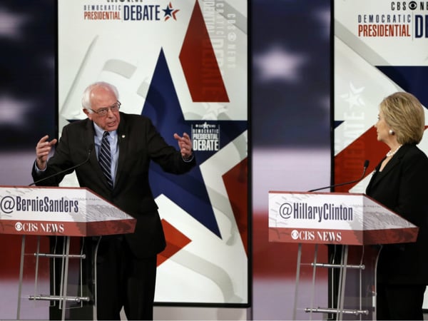 Bernie Sanders, left, makes a point as Hillary Rodham Clinton listens during a Democratic presidential primary debate, Saturday, Nov. 14, 2015, in Des Moines, Iowa.