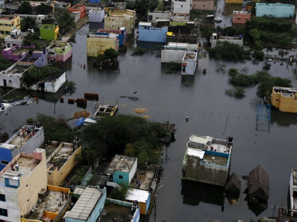 A residential area is seen surrounded by floodwaters in Chennai, India, Saturday, Dec. 5, 2015. 