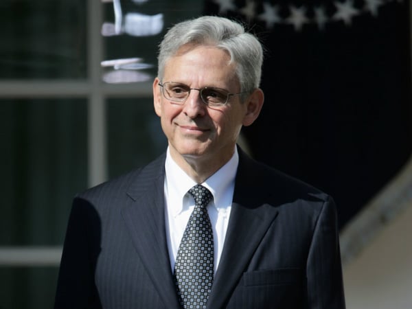 Merrick Garland at the Rose Garden on Wednesday.
