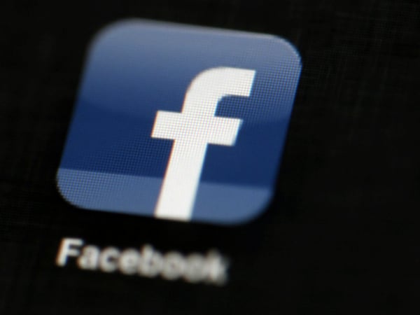 FILE - In this May 16, 2012 file photo, the Facebook logo is displayed on an iPad in Philadelphia. 