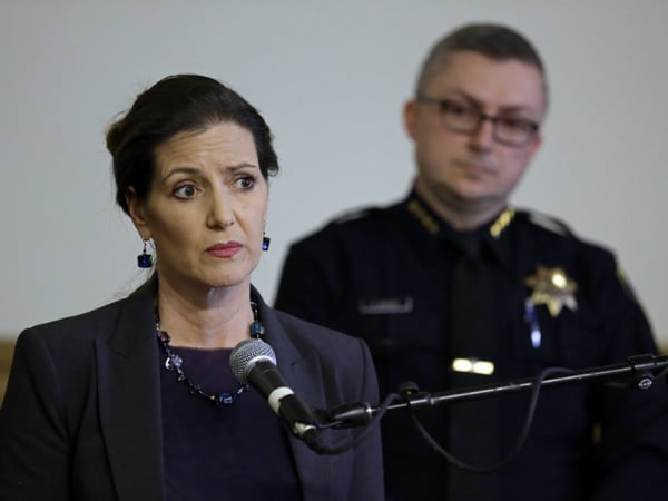 In this May 13, 2016 file photo, Oakland Mayor Libby Schaaf, left, speaks beside then-Oakland Chief of Police Sean Whent in Oakland, Calif. 