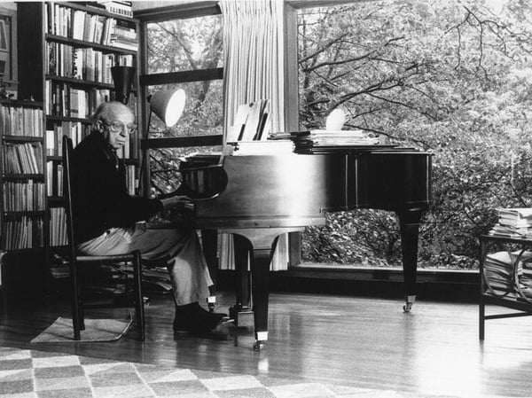 Aaron Copland at his piano. 