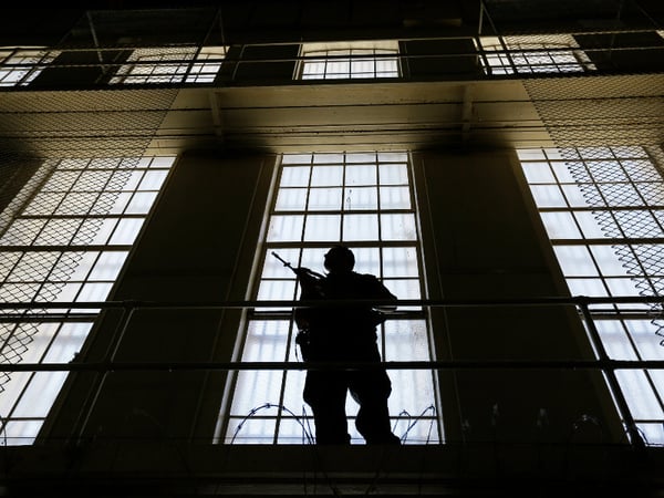A guard stands watch over the east block of death row at San Quentin State Prison Tuesday, Aug. 16, 2016, in San Quentin, Calif.