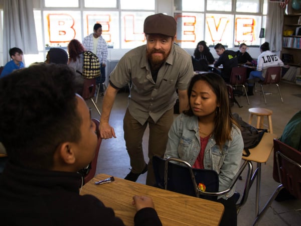 Michael Zysk leads 9th-graders in peer mentoring exercises during advocacy. 