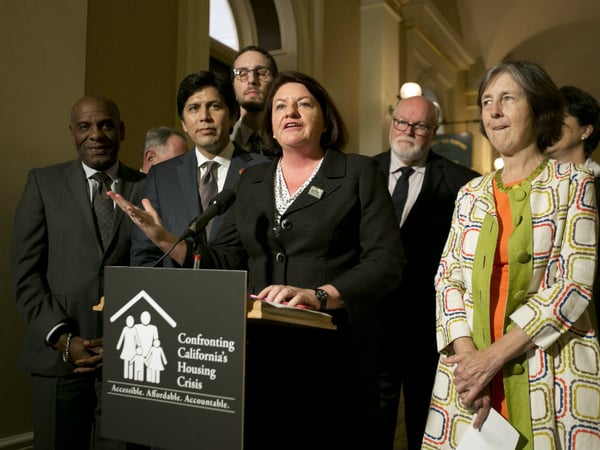 State Sen. Toni Atkins, D-San Diego, flanked by Senate President Pro Tem Kevin de Leon, D-Los Angeles, second from left, and other Democratic lawmakers discusses a package of housing bills approved by the Legislature Sept. 15, 2017, in Sacramento.