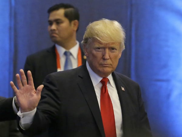 U.S. President Donald Trump waves as he arrives during the ASEAN-U.S. Summit on Monday, Nov. 13, 2017 in Manila, Philippines. 
