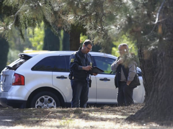 Law enforcement officers are seen at an elementary school in the community of Rancho Tehama Reserve, where a gunman opened fire Tuesday, Nov. 14, 2017, in Corning, Calif. 