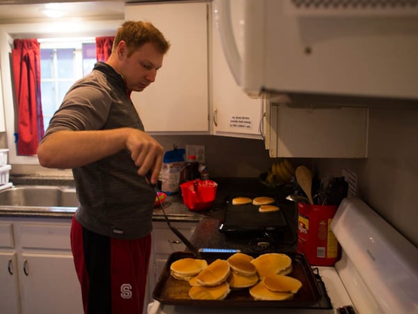Chris Fellmeth is able to volunteer in a daycare kitchen as part of his therapy he receives for his autism. 