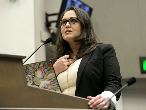 Lobbyist Pamela Lopez, tells members of an Assembly committee tasked with revising the California Assembly's sexual harassment policies, about her experiences Tuesday, Nov. 28, 2017, in Sacramento, Calif.