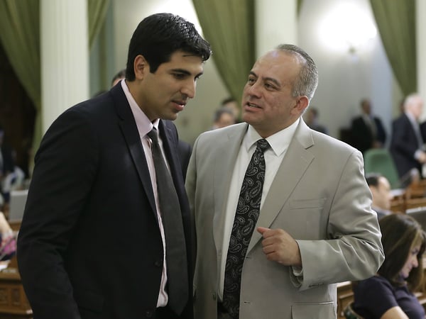 Assemblyman Raul Bocanegra, D-Pacoima, right, discusses a bill with Assemblyman Matt Dababneh, D-Van Nuys at the Capitol in Sacramento, Calif., Thursday, Aug. 28, 2014.