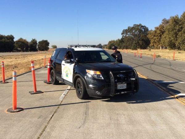 The California Highway Patrol training academy in West Sacramento includes courses for different scenarios. Here, a cadet runs over an orange cone while he learns how to parallel park.