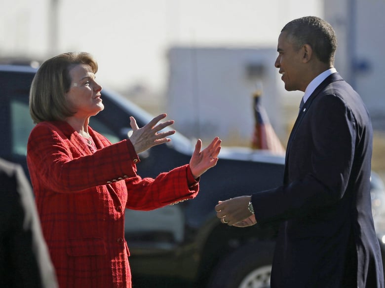 In this Nov. 25, 2013 file photo, President Barack Obama and Sen. Dianne Feinstein, D-Calif., greet each other on the tarmac upon his arrival on Air Force One at San Francisco International Airport. 