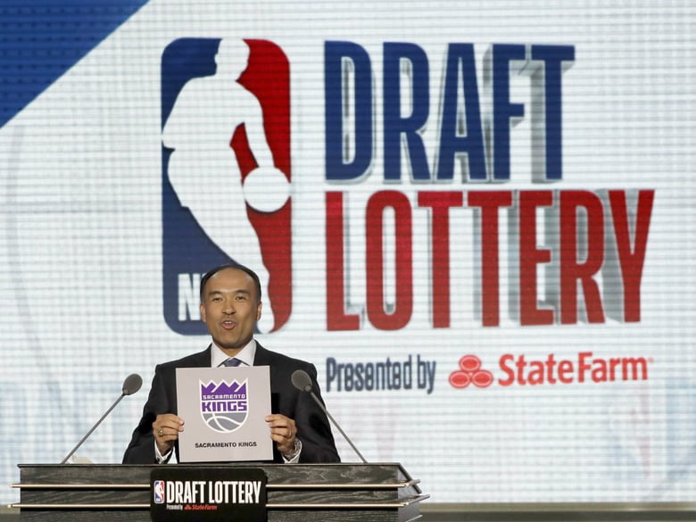NBA Deputy Commissioner Mark Tatum announces that the Sacramento Kings had won the second pick during the NBA basketball draft lottery Tuesday, May 15, 2018, in Chicago.