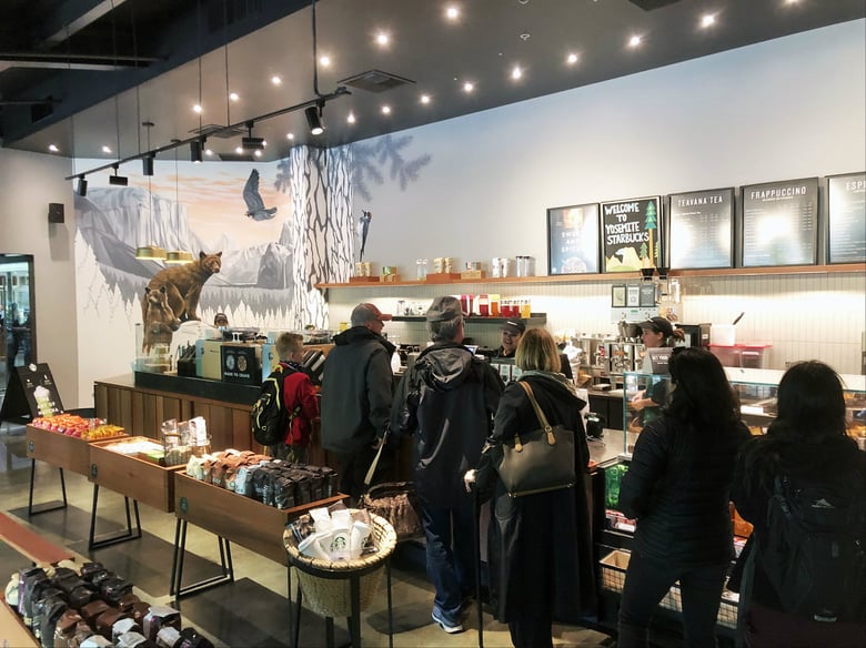 A Starbucks opened in Yosemite this spring. The move angered a lot of people, but having corporate America in the park isn't a new development.