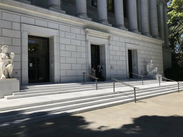 Chico Publishing Inc. co-owner Deborah Redmond and attorney Dan Laidman talk outside the 3rd District Court of Appeals in Sacramento.
