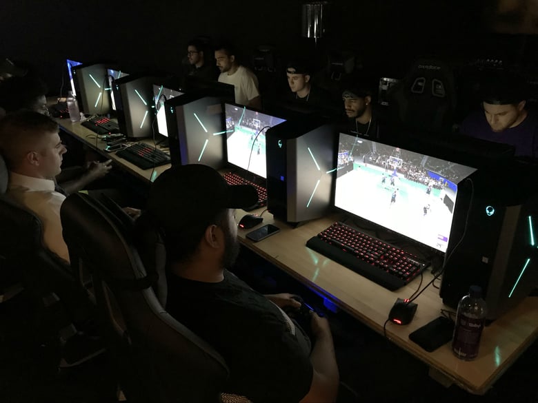 Sacramento Kings staff help prepare Kings Guard players for an upcoming NBA2K match.