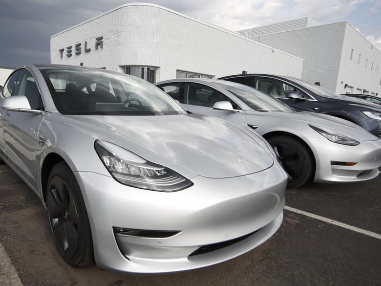 Model 3 sedans sit on display outside a Tesla showroom. For California to reach its ambitious climate change goals, every vehicle sold by 2040 in the state will have to be a zero-emissions vehicle.