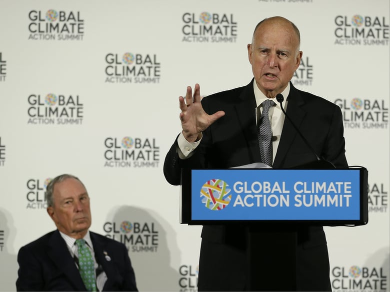 Gov. Jerry Brown speaks as Michael Bloomberg, left, listens during a news conference at the Global Action Climate Summit Thursday, Sept. 13, 2018, in San Francisco.