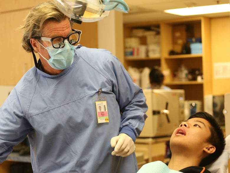 Long Beach dentist John Blake with patient Nelson Phan.