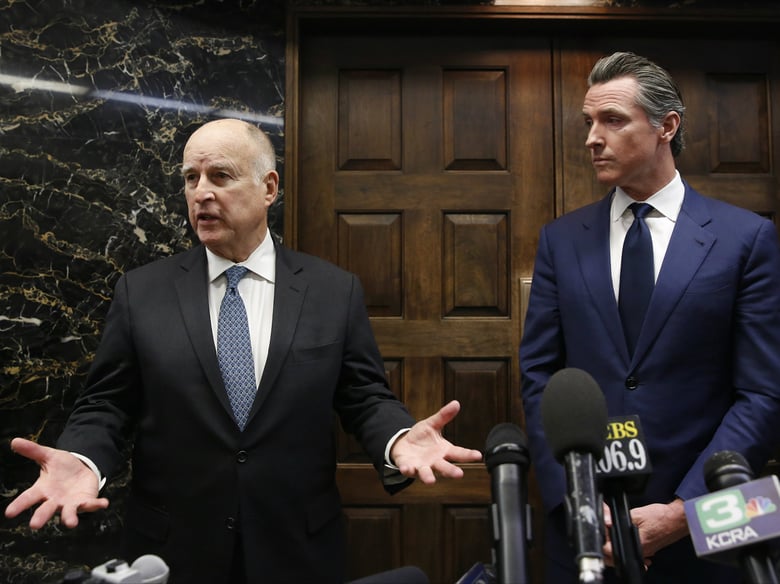 Gov. Jerry Brown, left, responds to a reporters question following a meeting with Governor-elect Gavin Newsom at the Capitol, Tuesday, Nov. 13, 2018, in Sacramento, Calif.
