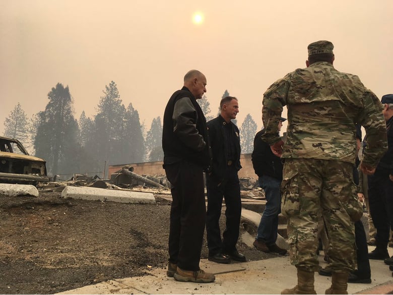 California Gov. Jerry Brown surveys Camp Fire damage with state officials, Interior Secretary Ryan Zinke and FEMA administrator Brock Long on Wednesday, Nov. 14, 2018.