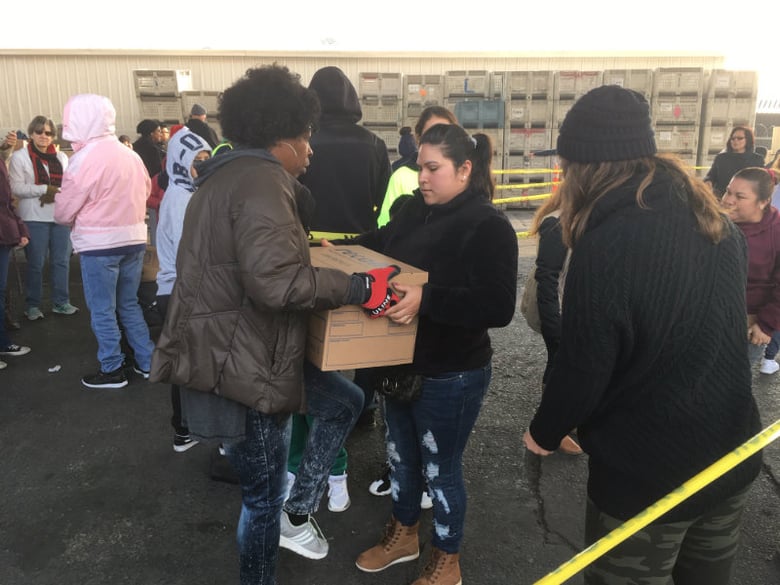 Volunteers hand out Thanksgiving food boxes in Stockton.