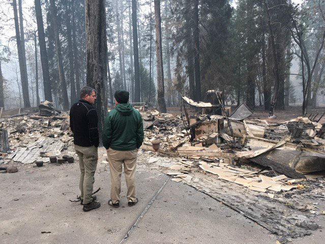 Assemblyman Jim Wood, left, surveys Camp Fire damage in Paradise with Loren Lighthall, principal of Paradise High School.