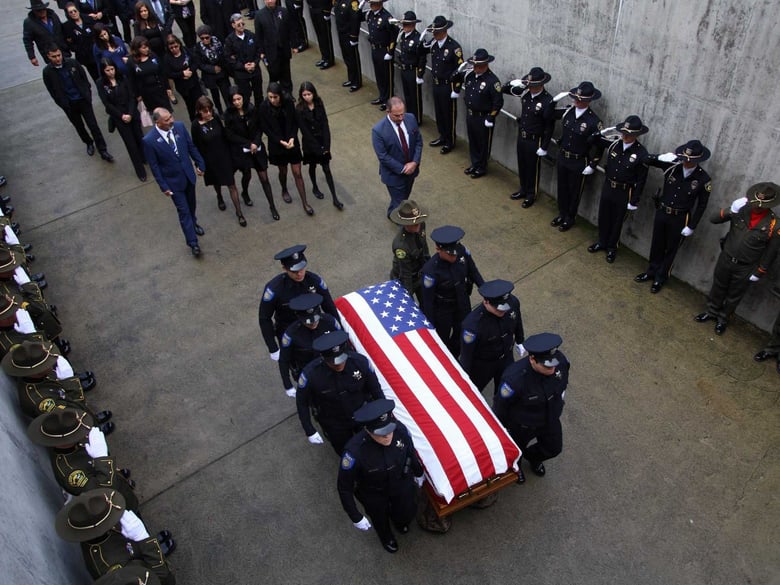 The body of slain Davis Police Officer Natalie Corona is carried into the ARC building at UC Davis ahead of her memorial service on Jan. 18, 2019.