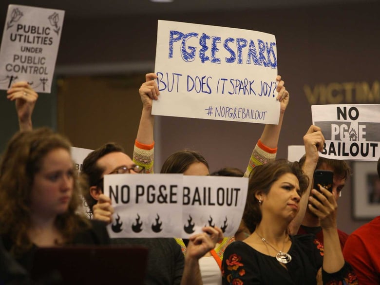 Audience members protest during the California Public Utilities Commission meeting on Jan. 31.
