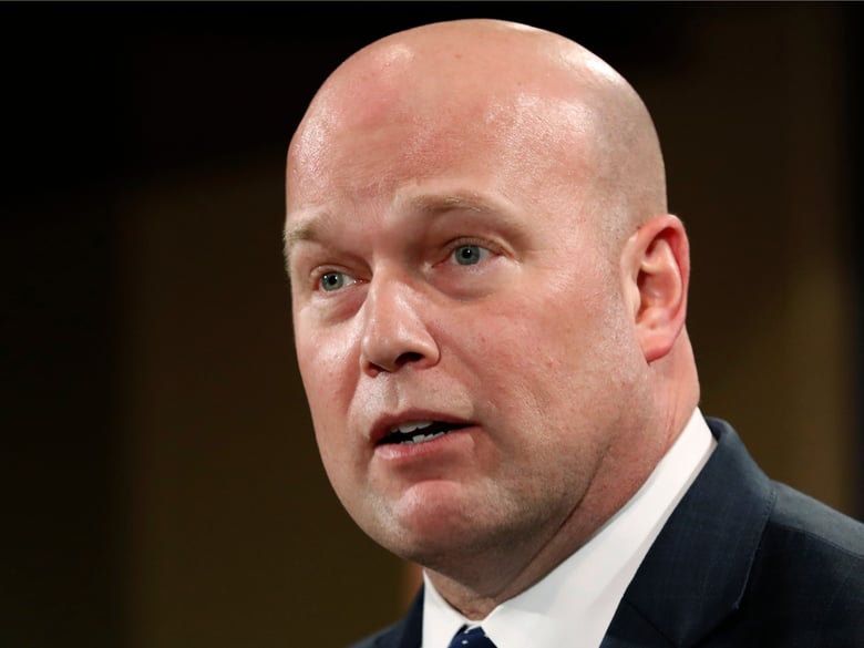 In this Jan. 28, 2019 file photo, Acting Attorney General Matt Whitaker announces an indictment on violations including bank and wire fraud at the Justice Department in Washington.