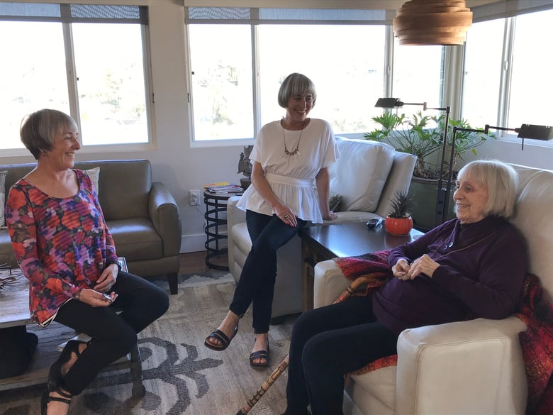 One-hundred-year-old Ginny Davenport enjoys a chat with her daughters Kelly Davenport (center) and Riley Davenport (left), Feb. 11, 2019.