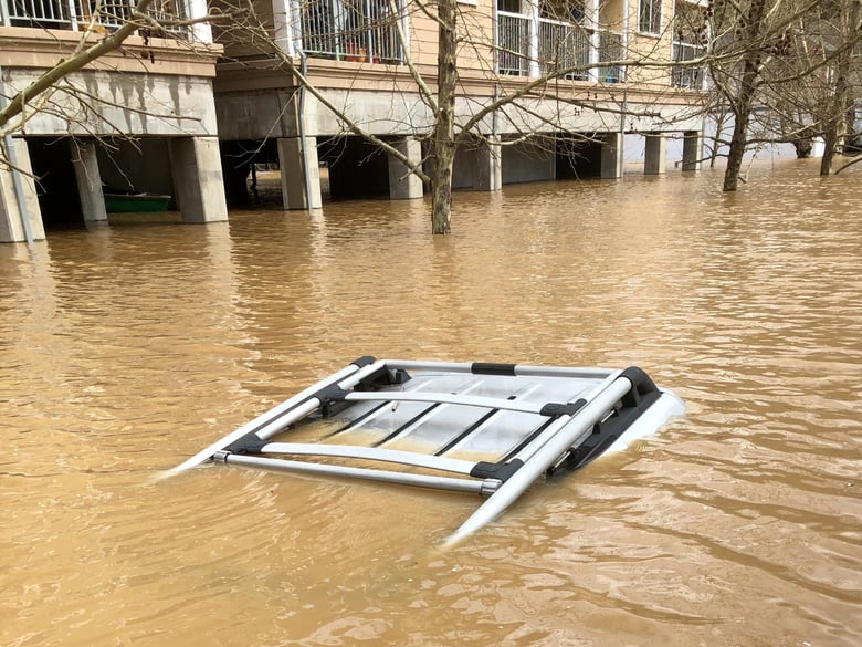 This photo provided by Jeff Bridges shows an SUV submerged along a flooded street in Guerneville, Calif. on Wednesday, Feb. 27, 2019.