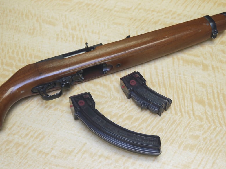 In this June 27, 2017 file photo, a semi-automatic rifle is displayed with a 25 shot magazine, left, and a 10 shot magazine, right, at a gun store in Elk Grove, Calif.