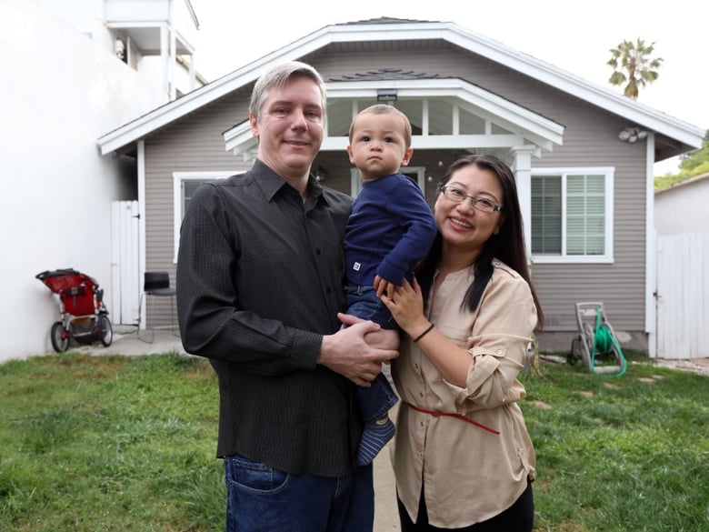 Inglewood taxpayers Jason and June Cao Jarvis, shown here at home with their 15-month-old son Kellar, say the federal tax cut actually increased their tax bill.