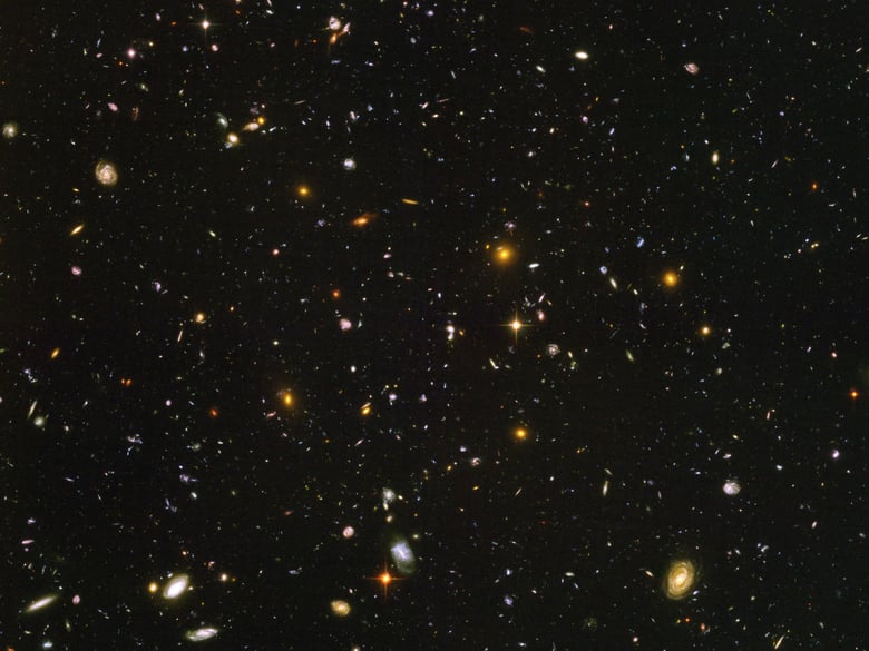 This image made from a composite of September 2003 - January 2004 photos captured by the NASA/ESA Hubble Space Telescope shows nearly 10,000 galaxies in the deepest visible-light image of the cosmos, cutting across billions of light-years.