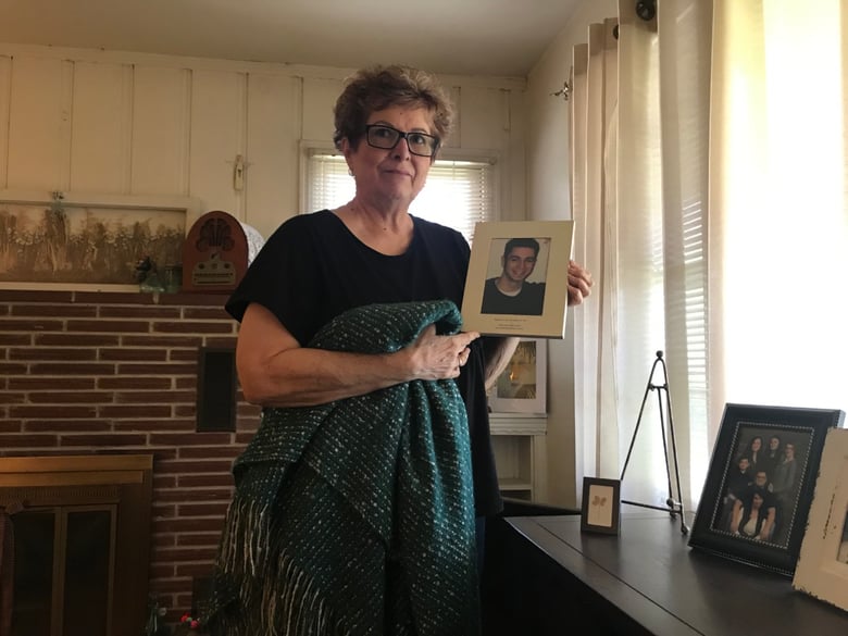 Former Capitol staffer Stepheny Milo with a photo of her son. “Matthew was my life. You took my life,” she told the defendants after he was shot to death.