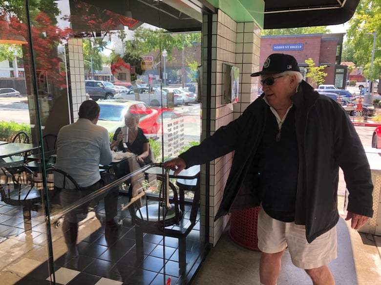 William Taylor, owner of Willie's Burgers, walks into his restaurant on 16th Street in Sacramento.