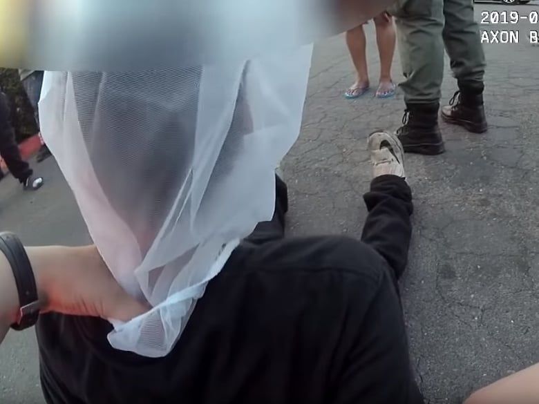 Body camera footage of officers arresting a boy and putting a ‘spit mask’ over his head was released by the Sacramento Police Department after a bystander video was shared by thousands on social media.